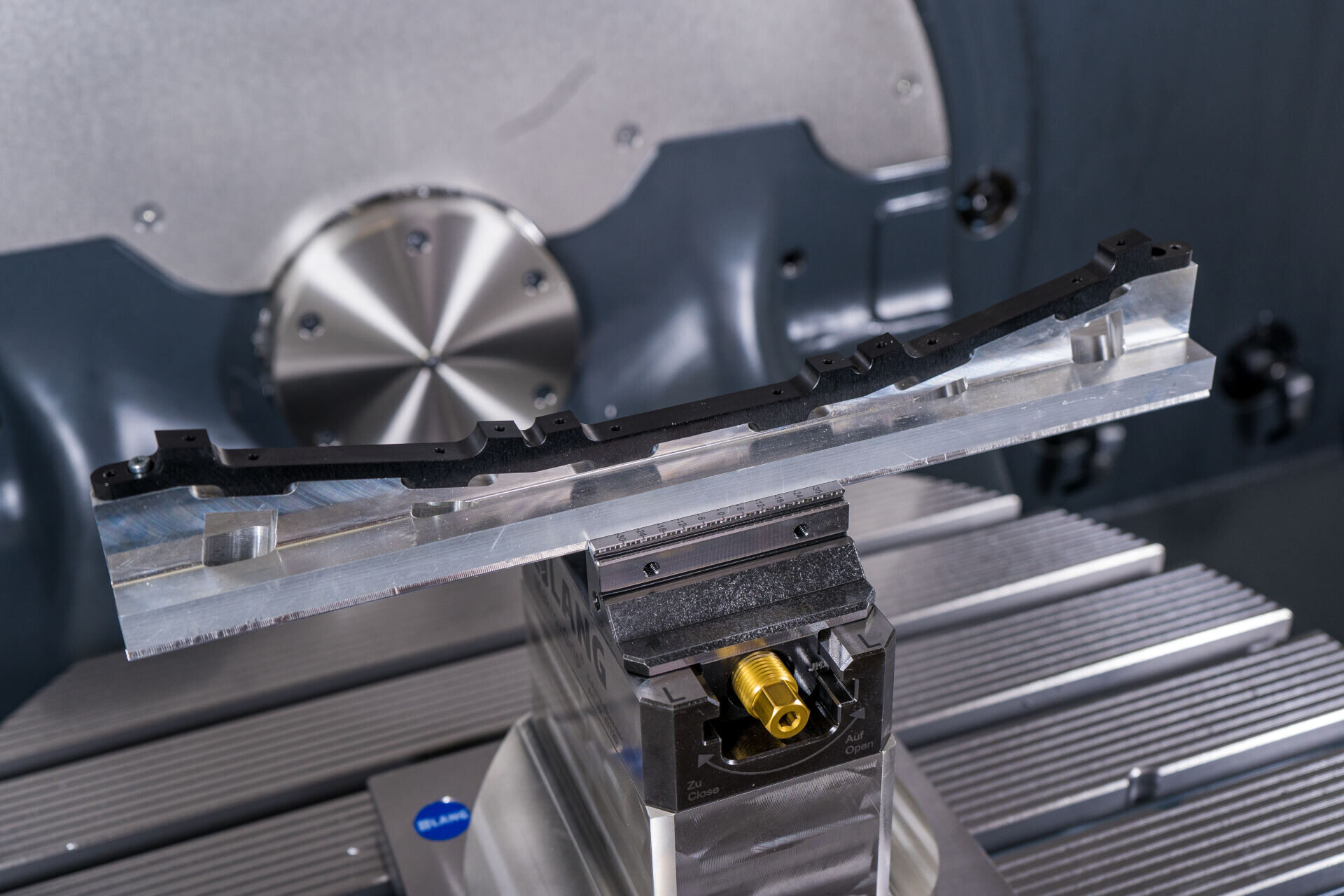 Component being machined in a CNC lathe