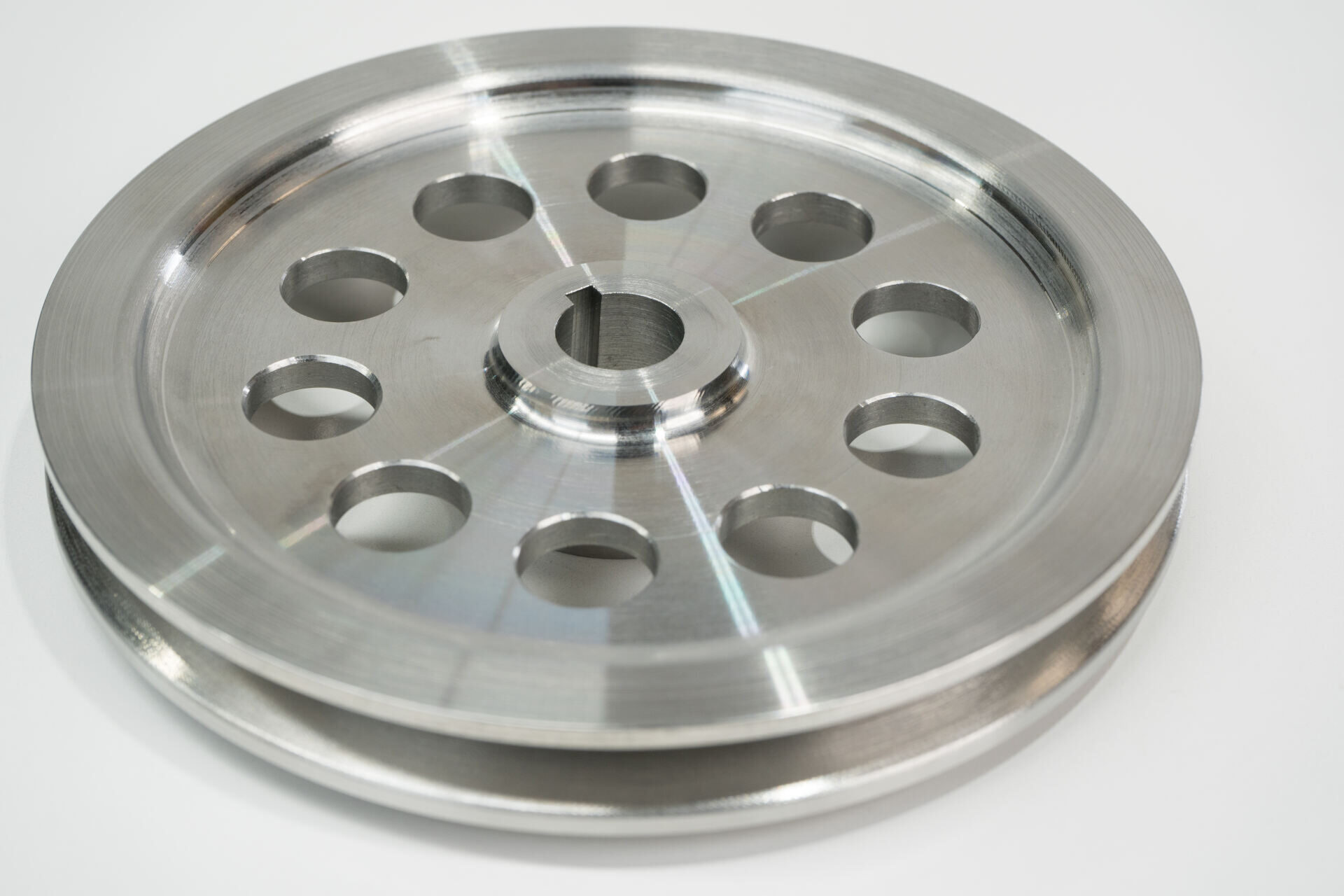 Turned pulley with drilled lightening holes